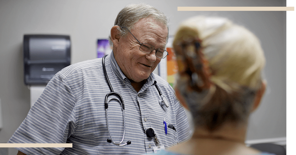 image of doctor talking to a patient